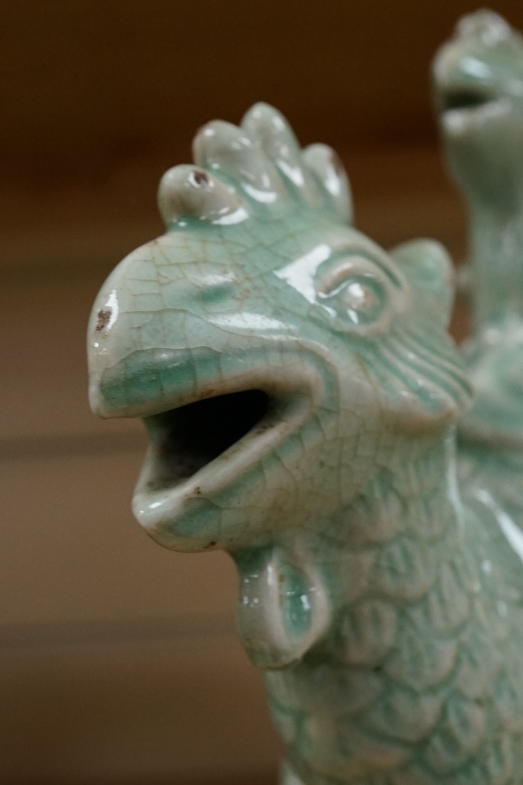 A Chinese celadon glazed ‘Phoenix’ wine ewer, late 19th century/ early 20th century, and a celadon glazed bowl, largest 26cm high